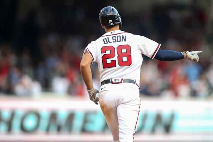 Oct 11, 2022; Atlanta, Georgia, USA; Atlanta Braves first baseman Matt Olson (28) points as he runs the bases after hitting a three-run home run against the Philadelphia Phillies in the ninth inning during game one of the NLDS for the 2022 MLB Playoffs at Truist Park. Mandatory Credit: Brett Davis-USA TODAY Sports